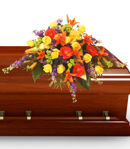 A Light Shines Through Casket Spray - Same Day Flower Delivery